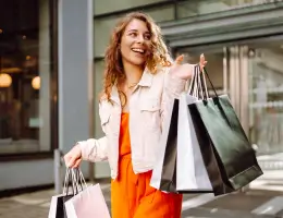 a woman holding shopping bags
