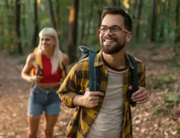 two people hiking in a forest